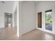 Inviting foyer featuring tile flooring, high ceilings, and a view to the outside at 453 Sorrento Rd, Kissimmee, FL 34759