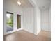Bright and airy foyer with tile flooring, recessed lighting, and a view of the landscaped front yard at 453 Sorrento Rd, Kissimmee, FL 34759