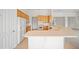 Open kitchen with wood cabinetry, stainless steel appliances, and a spacious breakfast bar at 453 Sorrento Rd, Kissimmee, FL 34759