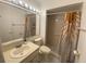 Bathroom with shower, vanity, and patterned shower curtain at 561 Portland Cir, Apopka, FL 32703