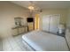 Main bedroom featuring a ceiling fan, closet, and a dresser at 561 Portland Cir, Apopka, FL 32703