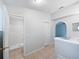 Bright bathroom featuring tiled floors, white walls, and a walk-in shower at 612 Doe Cove Pl, Apopka, FL 32703