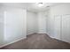 Bedroom featuring neutral carpeting, closet, and door at 612 Doe Cove Pl, Apopka, FL 32703