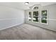 Bright bedroom with natural light and carpeting at 612 Doe Cove Pl, Apopka, FL 32703
