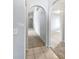 Hallway with arched doorways leading to other rooms at 612 Doe Cove Pl, Apopka, FL 32703
