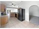 Kitchen view, featuring black refrigerator and views into living room at 612 Doe Cove Pl, Apopka, FL 32703