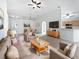 Bright and airy living room featuring an open floor plan with a view of the dining area at 612 Doe Cove Pl, Apopka, FL 32703