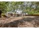 Large backyard featuring a fenced in area and a view of the rear exterior of the home at 6245 Sleepy Hollow Dr, Orlando, FL 32810