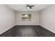 Bright bedroom featuring new flooring, fresh paint and a large window at 6245 Sleepy Hollow Dr, Orlando, FL 32810