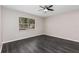 Bedroom with new floors, fresh paint and a large bright window at 6245 Sleepy Hollow Dr, Orlando, FL 32810