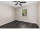 Bedroom featuring luxury vinyl plank flooring, a ceiling fan and neutral colored walls at 6245 Sleepy Hollow Dr, Orlando, FL 32810