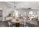 Open-concept living and dining area features hardwood floors and modern lighting fixtures at 6245 Sleepy Hollow Dr, Orlando, FL 32810