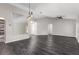 Spacious living room features new flooring, large mirrors, ceiling fan, and plenty of natural light at 6245 Sleepy Hollow Dr, Orlando, FL 32810
