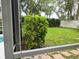 Well-maintained backyard with lush greenery, a white fence, and a serene outdoor ambiance at 635 Whitman Cv, Longwood, FL 32750