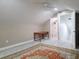 Upstairs bedroom featuring neutral walls, carpet, a desk, and an ensuite bathroom at 635 Whitman Cv, Longwood, FL 32750