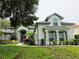 Charming two-story home with mature landscaping and stylish architectural details at 635 Whitman Cv, Longwood, FL 32750