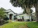 Charming single-Gathering home with mature landscaping, green lawn, and moss-draped trees at 635 Whitman Cv, Longwood, FL 32750
