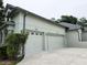 Attached two-car garage and manicured landscaping add curb appeal at 635 Whitman Cv, Longwood, FL 32750
