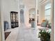Open hallway showcasing architectural details, elegant furnishings, and bright lighting at 635 Whitman Cv, Longwood, FL 32750