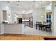 Bright kitchen with stainless steel appliances, granite countertops, tile floor, breakfast nook, and bar seating at 635 Whitman Cv, Longwood, FL 32750