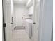 Neat laundry room featuring a washer, dryer, and white cabinets for convenient storage at 635 Whitman Cv, Longwood, FL 32750