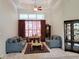 Elegant living room featuring high ceilings, large windows, and sophisticated decor at 635 Whitman Cv, Longwood, FL 32750