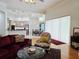 Cozy living room with hardwood floors next to a kitchen and dining area at 635 Whitman Cv, Longwood, FL 32750