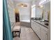 Bright bathroom features double vanity, soaking tub, and glass block shower at 635 Whitman Cv, Longwood, FL 32750
