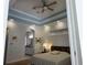 Comfortable main bedroom with neutral walls and en suite bathroom at 635 Whitman Cv, Longwood, FL 32750