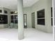 Spacious screened-in patio featuring tile flooring, ceiling fan, and comfortable seating area at 635 Whitman Cv, Longwood, FL 32750