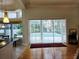 View from inside to a screened-in pool area through large sliding glass doors at 635 Whitman Cv, Longwood, FL 32750