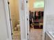 See the toilet room and walk-in closet off of the Primary bathroom at 635 Whitman Cv, Longwood, FL 32750