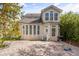 Rear elevation of the home with large backyard brick patio at 704 Honeysuckle Ave, Kissimmee, FL 34747