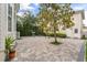 Brick patio and landscaped backyard at 704 Honeysuckle Ave, Kissimmee, FL 34747