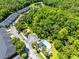 Aerial view of the community pool, clubhouse, and surrounding lush landscape at 707 Evening Sky Dr, Oviedo, FL 32765