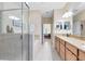 Bathroom featuring double vanity with granite counters, a bathtub and a separate shower at 707 Evening Sky Dr, Oviedo, FL 32765