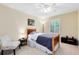 Cozy bedroom with a ceiling fan, a single bed, a black cabinet, and a window dressed with shutter blinds at 707 Evening Sky Dr, Oviedo, FL 32765