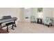 Bonus room featuring musical instruments, two patterned chairs and an adjacent hallway leading to another room at 707 Evening Sky Dr, Oviedo, FL 32765