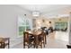Cozy dining area featuring a modern light fixture and a window with natural light and views of the community at 707 Evening Sky Dr, Oviedo, FL 32765