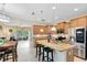 Bright kitchen featuring stainless steel appliances, granite countertops, a kitchen island, and pendant lighting at 707 Evening Sky Dr, Oviedo, FL 32765