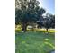 A beautiful green lawn with mature trees offering plenty of shade, creating a peaceful outdoor ambiance at 724 Barrington Cir, Winter Springs, FL 32708