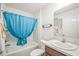 Bathroom featuring a shower and bathtub combination with curtain and vanity at 747 Louise Ln, The Villages, FL 32163