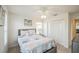 Bedroom featuring ceiling fan, double windows, and closet space at 747 Louise Ln, The Villages, FL 32163