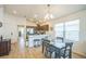 Cozy dining area with seating for four, adjacent to a modern kitchen and bright windows at 747 Louise Ln, The Villages, FL 32163