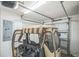 Garage features an open door and houses a golf cart at 747 Louise Ln, The Villages, FL 32163