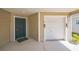 Front door and garage door of a cozy house at 747 Louise Ln, The Villages, FL 32163