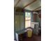 Cozy bathroom with hardwood floors, custom decor and storage, and bright window at 748 W Florence Ave, Deland, FL 32720