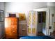Bedroom showcasing wardrobe, stained-glass door detail, and adjacent room access at 748 W Florence Ave, Deland, FL 32720