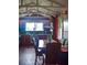 Charming kitchen with wooden floors, exposed beams, large window, and dining area at 748 W Florence Ave, Deland, FL 32720