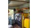 Well-lit laundry room with washer and dryer, bright window, and charming decor at 748 W Florence Ave, Deland, FL 32720
